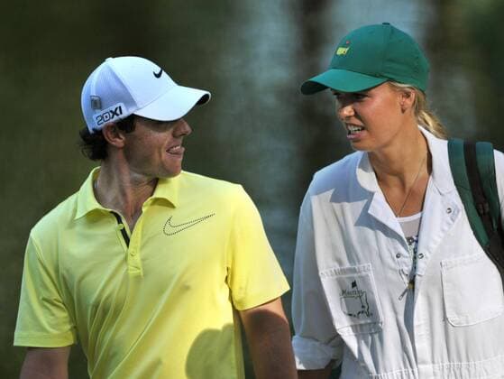 Rory McIlroy and his girlfriend Caroline Wozniacki walk to the 9th green during the Masters Par 3 Contest a day before the beginning of the Masters tournament at Augusta National, on April 10, 2013 in Augusta, Georgia.  AUG20130410321