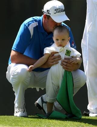 April 10, 2013 - Augusta, GA, USA - Marc Leishman kisses his 15-month-old son, Harvey, as he waits to play on the 4th green during the Par 3 Contest at the Masters at Augusta National Golf Club on Wednesday, April 10, 2013, in Augusta, Georgia. Masters at Augusta National Golf Club - ZUMAm67