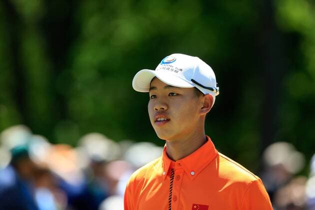(130411) -- AUGUSTA, April 10, 2013 (Xinhua) -- China s Guan Tianlang walks to the No. 1 green during the Par 3 Contest for the 2013 Masters at the Augusta National Golf Club in Augusta, Georgia, the United States, on April 10, 2013. (Xinhua Chris Trotman Augusta National) (zf) U.S.-AUGUSTA-2013 MASTERS-PAR 3 CONTEST-CHINA-GUAN TIANLANG 