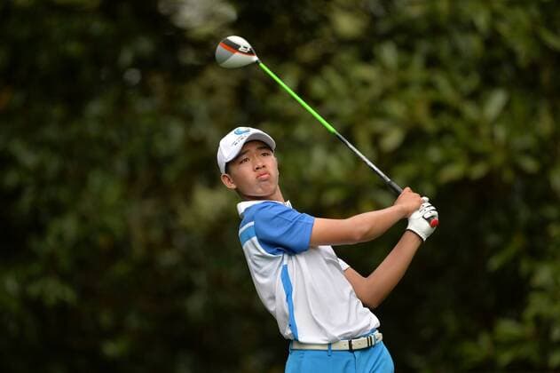 Guan Tianlang watches after hitting a shot off of the 11th tee box during the first round of the Masters at Augusta National on April 11, 2013 in Augusta, Georgia.  AUG20130411358