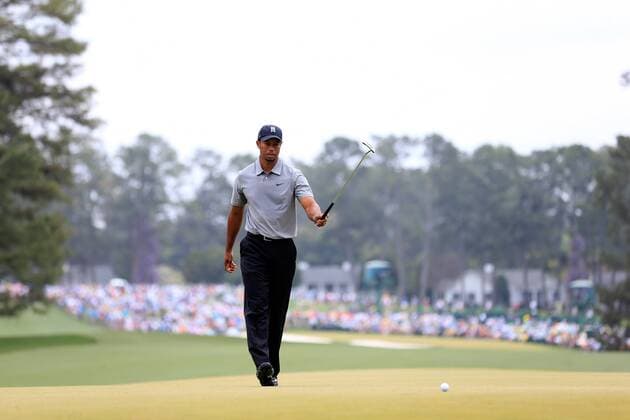 (130412) -- AUGUSTA, April 11, 2013 (Xinhua) -- Tiger Woods of the United States reacts to a putt during the first round of the 2013 Masters golf tournament at the Augusta National Golf Club in Augusta, Georgia, the United States, April 11, 2013. Woods shot a two-under par 70 on Thursday. (Xinhua Chris Trotman Augusta National) U.S.-AUGUSTA-GOLF-2013 MASTERS 