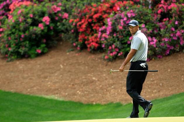 (130412) -- AUGUSTA, April 11, 2013 (Xinhua) -- Tiger Woods of the United States reacts during the first round of the 2013 Masters golf tournament at the Augusta National Golf Club in Augusta, Georgia, the United States, April 11, 2013. Woods shot a two-under par 70 on Thursday. (Xinhua Charles Laberge Augusta National) U.S.-AUGUSTA-GOLF-2013 MASTERS 