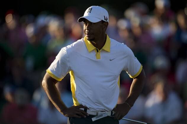 Tiger Woods stands on the 18th green during the second round of the Masters at Augusta National on April 12, 2013 in Augusta, Georgia.  AUG20130412356