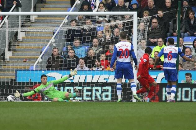 Football - 2012 2013 Premier League - Reading vs. Liverpool Philippe Coutinho of Liverpool slots the ball past Readings Alex McCarthy only for his goal to be ruled out for offside 