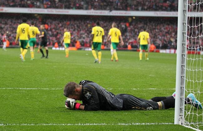 Norwich s Mark Bunn looks on dejected after conceding a penalty.. FC Arsenal London vs Norwich City - Barclays Premier League - Emirates Stadium, London- 12 04 13 - EDITORIAL USE ONLY. No use with unauthorised audio, video, data, fixture lists, club league logos or live services. Online in-match use limited to 120 images, no video emulation. No use in betting, games or single club league player publications.