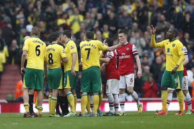 Norwich s players argue with referee Mike Jones after the award of a penalty.. FC Arsenal London vs Norwich City - Barclays Premier League - Emirates Stadium, London- 12 04 13 - EDITORIAL USE ONLY. No use with unauthorised audio, video, data, fixture lists, club league logos or live services. Online in-match use limited to 120 images, no video emulation. No use in betting, games or single club league player publications.