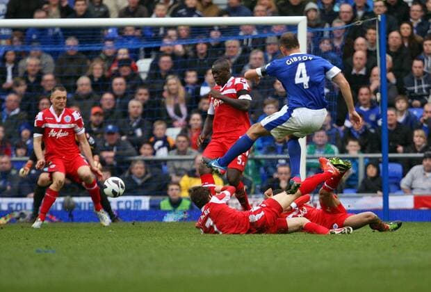 Evertons s Darren Gibson s shot hits QPR Defender Clint Hill nad ends up in the back of the net- Barclays Premier League - FC Everton vs Queens Park Rangers QPR - Goodison Park -Liverpool- 13th April 2013 - EDITORIAL USE ONLY. No use with unauthorised audio, video, data, fixture lists, club league logos or live services. Online in-match use limited to 120 images, no video emulation. No use in betting, games or single club league player publications.