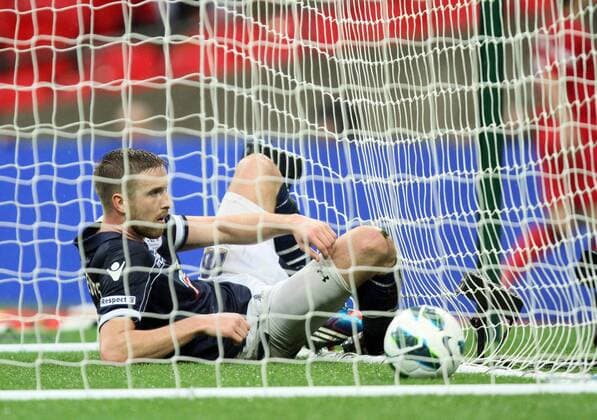 Pic: Paul Marriott . . FA Cup Semi-Final - Millwall v Wigan Athletic . . 13.04.13 Mark Beevers (M) dejection after the winning Wigan goal. 