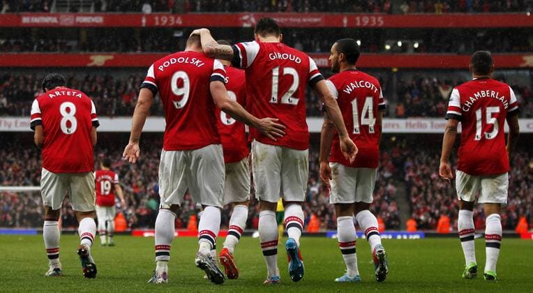 LONDON, April 13, 2013 - Lukas Podolski (2nd, L) of Arsenal celebrates scoring with his teammates during the Barclays Premier League match between Arsenal and Norwich City at the Emirates Stadium in London, Britain, on April 13, 2013. Arsenal won 3-1. (Xinhua Wang Lili) 