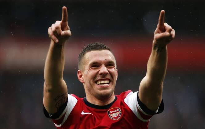 LONDON, April 13, 2013 - Lukas Podolski of Arsenal celebrates scoring during the Barclays Premier League match between Arsenal and Norwich City at the Emirates Stadium in London, Britain, on April 13, 2013. Arsenal won 3-1. (Xinhua Wang Lili) 