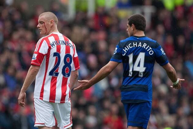 Football - 2012 2013 Premier League - Stoke City vs. Manchester United ManU Javier Hernandez of Manchester United ManU protests his innocence as Stoke s Andy Wilkinson receives a cut from a high boot at the Britannia Stadium 
