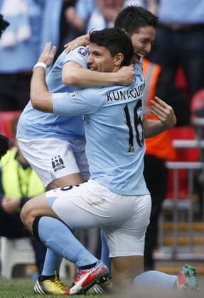 LONDON, April 14, 2013 (Xinhua) -- Sergio Aguero (R) of Manchester City celebrates scoring with his teammate Samir Nasri during FA Cup semifinal between Manchester City and Chelsea at Wembley Stadium in London, Britain, on April 14, 2013. Manchester City won 2-1 and will meet Wigan Athletic in the FA Cup final. (Xinhua Wang Lili) (zf) , -FA CUP-SEMIFINAL-MAN CITY VS CHELSEA 