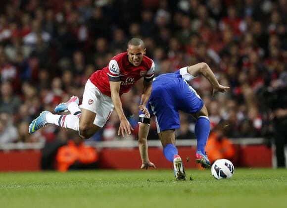 Arsenal s Theo Wacott gets body checked by Everton s Darron Gibson who was already booked but not given another card..Arsenal v Everton - Barclays Premier League - Emirates Stadium, London- 16 04 13 - Picture David Klein Sportimage EDITORIAL USE ONLY. No use with unauthorised audio, video, data, fixture lists, club league logos or live services. Online in-match use limited to 120 images, no video emulation. No use in betting, games or single club league player publications.