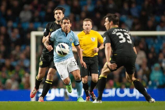 Football - 2012 2013 Premier League - Manchester City vs. Wigan Athletic Wigan s Jordi Gomez and Carlos Tevez of Manchester City at the Etihad Stadium 