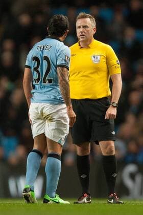 Football - 2012 2013 Premier League - Manchester City vs. Wigan Athletic Carlos Tevez of Manchester City argues with referee Jon Moss at the Etihad Stadium 