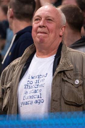 Football - 2012 2013 Premier League - Manchester City vs. Wigan Athletic A Wigan fan wears a t-shirt stating I wanted to give Thatcher a state funeral years ago at the Etihad Stadium 