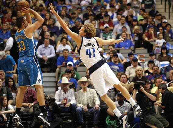 April 17, 2013 - Dallas, TX, USA - Dallas Mavericks power forward Dirk Nowitzki (41) defends as New Orleans Hornets power forward Ryan Anderson (33) launches a three-point shot on Wednesday April 17, 2013, in Dallas, Texas. HORNETS MAVERICKS  - ZUMAICK