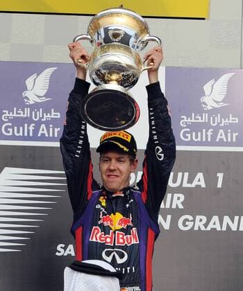(130421) -- MANAMA, April 21, 2013 (Xinhua) -- Red Bull driver Sebastian Vettel celebrates with the winner s trophy during the victory ceremony of the Bahrain F1 Grand Prix at the Bahrain International Circuit in Manama, Bahrain, on April 21, 2013. (Xinhua Chen Shaojin) (zf) BAHRAIN-MANAMA-F1 