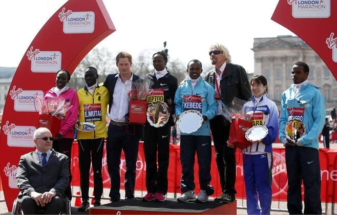(130421) -- LONDON, April 21, 2013 (Xinhua) -- Prince Harry (3rd L) poses with the top three athletes from Mens and Womens Elite races during the awarding ceremony for 2013 London Marathon in London, Britain on April 21, 2013. (Xinhua Wang Lili)(zf) BRITAIN-LONDON-MARATHON 