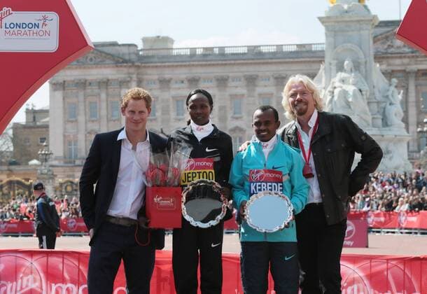 HRH Prince Harry and Virgin CEO Sir Richard Branson stand side by side with the Men and Womens 2013 London Marathon winners Kenya s Priscah Jeptoo and Ethiopia s Tsegaye Kebede at the 2013 London Marathon in London on April 21 2013.  LON2013042113