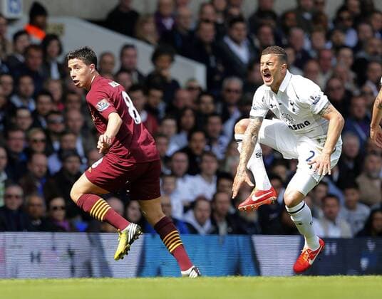 Tottenham s Kyle Walker gets caught late by Manchester City s Samir Nasri but no card is shown..Tottenham Hotspur v Manchester City - Barclays Premier League - White Hart Lane, London- 21 04 13 - EDITORIAL USE ONLY. No use with unauthorised audio, video, data, fixture lists, club league logos or live services. Online in-match use limited to 120 images, no video emulation. No use in betting, games or single club league player publications.