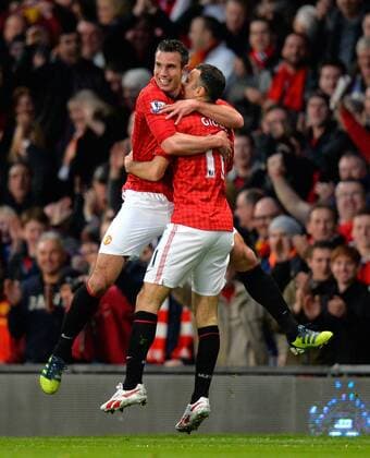 Goalscorer Robin van Persie of Manchester United celebrates his second goal with Ryan Giggs of Manchester United - Barclays Premier league - Manchester Utd vs Aston Villa - Old Trafford Stadium - Manchester - 22 04 13 - Picture Simon Bellis Sportimage EDITORIAL USE ONLY. No use with unauthorised audio, video, data, fixture lists, club league logos or live services. Online in-match use limited to 120 images, no video emulation. No use in betting, games or single club league player publications.