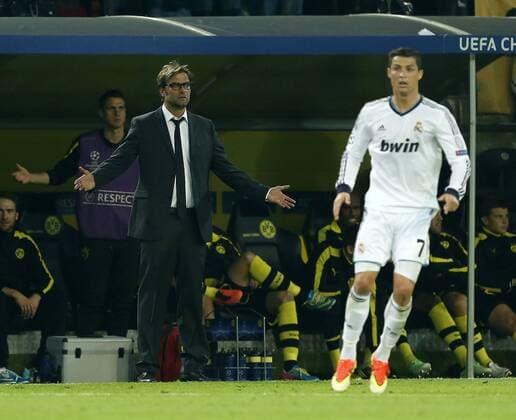 Dortmund s Jurgen Klopp and Madrid s Cristiano Ronaldo in action..Borussia Dortmund v Real Madrid - Champions League, Semi Final 1st Leg- Westfalenstadion, Dortmund- 24 04 13 - Picture David Klein Sportimage EDITORIAL USE ONLY. No use with unauthorised audio, video, data, fixture lists, club league logos or live services. Online in-match use limited to 120 images, no video emulation. No use in betting, games or single club league player publications.