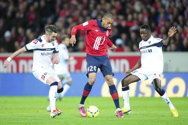 Ronny Rodelin(Lille) vs Mathieu Philippe Peybernes - Joseph Romeric Lopy (Sochaux) FOOTBALL : Lille vs Sochaux - Ligue 1 - 26 04 2013 JBAutissier Panoramic 
