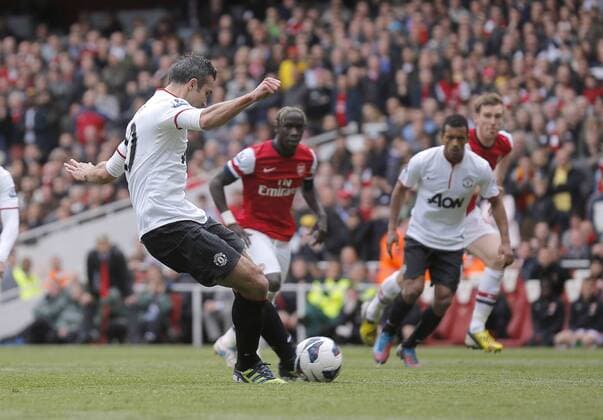 Robin van Persie scores from the penalty spot for Manchester United - Barclays Premier League - FC Arsenal vs Manchester United (ManU) - Emirates Stadium London - Season 12 13 - 28th April 2013 - EDITORIAL USE ONLY. No use with unauthorised audio, video, data, fixture lists, club league logos or live services. Online in-match use limited to 120 images, no video emulation. No use in betting, games or single club league player publications.