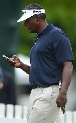 April 30, 2013 - Charlotte, NC, USA - Vijay Singh checks his phone on Tuesday, April 30, 2013, during a practice round for the Wells Fargo Championship at Quail Hollow Club in Charlotte, North Carolina. Wells Fargo Championship - ZUMAm67