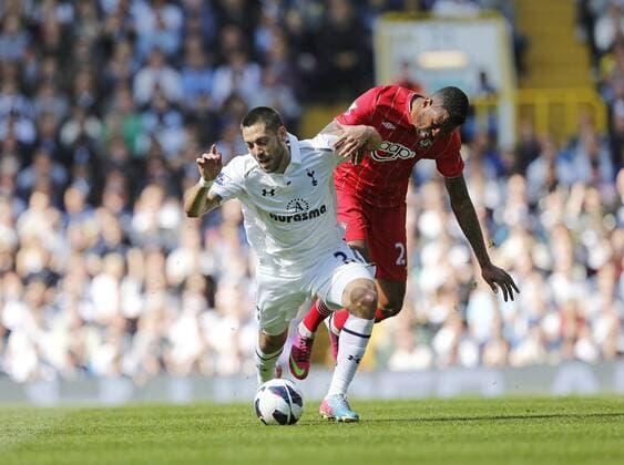 Tottenham s Clint Dempsey tussles with Southampton s Guly Do Prado..- Barclays Premier League - Tottenham vs Southampton - White Hart Lane - London - 4th May 2013 - Pic David Klein Sportimage EDITORIAL USE ONLY. No use with unauthorised audio, video, data, fixture lists, club league logos or live services. Online in-match use limited to 120 images, no video emulation. No use in betting, games or single club league player publications.
