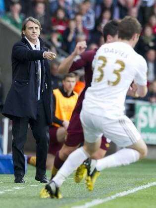 Football - 2012 2013 Premier League - Swansea City vs. Manchester City, roberto mancini points at play. 
