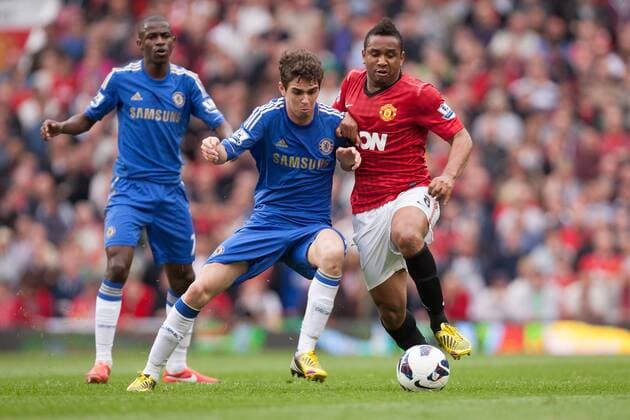 Football - 2012 2013 Premier League - Manchester United vs. Chelsea Oscar of Chelsea battles Anderson of Manchester United at Old Trafford 