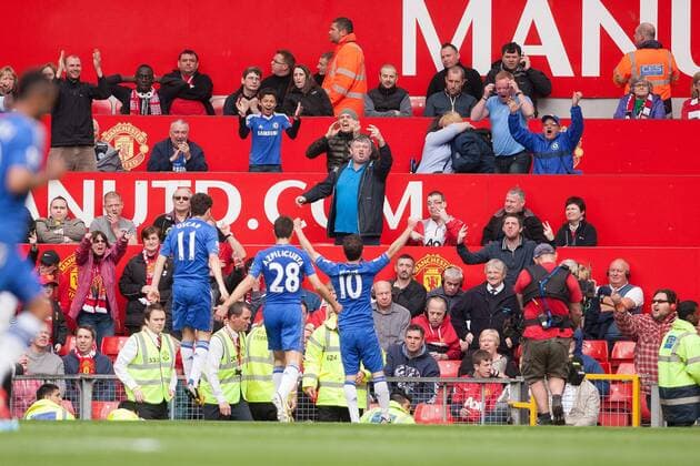 Football - 2012 2013 Premier League - Manchester United vs. Chelsea Juan Mata of Chelsea celebrates his goal in front of a mixed reception at Old Trafford