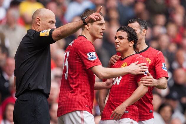 Football - 2012 2013 Premier League - Manchester United vs. Chelsea Rafael of Manchester United reacts to his red card at Old Trafford