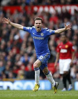 Juan Mata of Chelsea celebrates scoring the winning goal during the Barclays Premier League match between Manchester United and Chelsea at Old Trafford in Manchester, Britain on May 5, 2013. Chelsea won 1-0.(Xinhua Wang Lili) FOR EDITORIAL USE ONLY. NOT FOR SALE FOR MARKETING OR ADVERTISING CAMPAIGNS. NO USE WITH UNAUTHORIZED AUDIO, VIDEO, DATA, FIXTURE LISTS, CLUB LEAGUE LOGOS OR LIVE SERVICES. ONLINE IN-MATCH USE LIMITED TO 45 IMAGES, NO VIDEO EMULATION. NO USE IN BETTING, GAMES OR SINGLE CLUB LEAGUE PLAYER PUBLICATIONS. BRITAIN-MANCHESTER-SOCCER-PREMIER LEAGUE-MAN UTD VS CHELSEA
