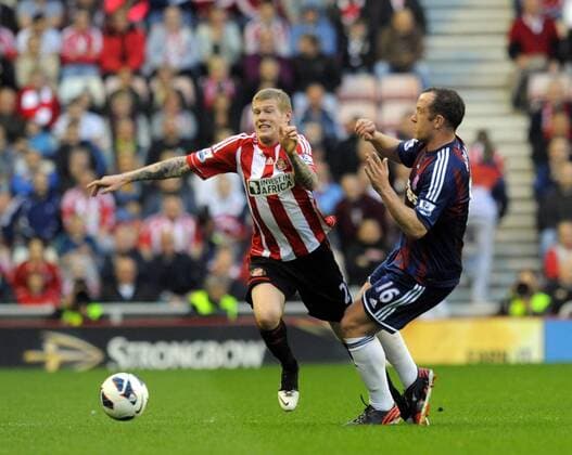 James McClean of Sunderland (L) is caught by Charlie Adam of Stoke City - Barclays Premier League - Sunderland vs Stoke City - Stadium of Light - Sunderland - 06 05 13 - Picture Richard Lee Sportimage EDITORIAL USE ONLY. No use with unauthorised audio, video, data, fixture lists, club league logos or live services. Online in-match use limited to 120 images, no video emulation. No use in betting, games or single club league player publications.