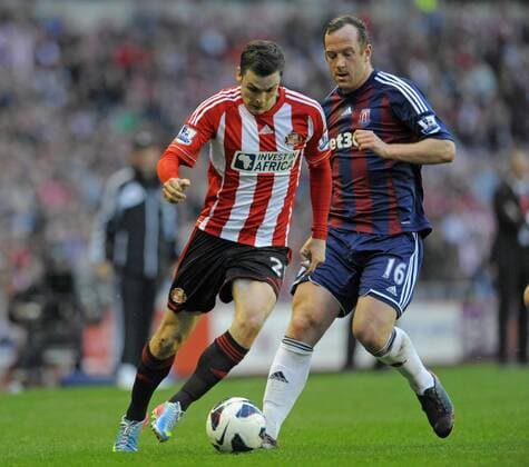 Adam Johnson of Sunderland (L) and Charlie Adam of Stoke City - Barclays Premier League - Sunderland vs Stoke City - Stadium of Light - Sunderland - 06 05 13 - Picture Richard Lee Sportimage EDITORIAL USE ONLY. No use with unauthorised audio, video, data, fixture lists, club league logos or live services. Online in-match use limited to 120 images, no video emulation. No use in betting, games or single club league player publications.