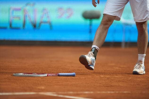 (130508) -- MADRID, May 7, 2013 (Xinhua) -- German player Florian Mayer throws his racket at the Madrid Open tennis tournament in Madrid on May 7, 2013. Murray won 2-0 and advanced to the next round. (Xinhua Xie Haining) SPAIN-MADRID-TENNIS-MADRID OPEN 