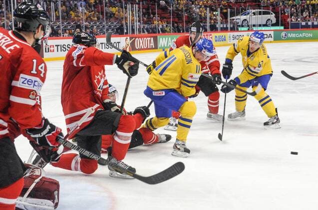 Stockholm 2013 05 0 Ice-Hockey World Championship 2013 - Sweden SWE vs Canada CAN - Pictures shows Swedes Simon Hjalmarsson SWE 11 and Martin Törnberg SWE 67 - KPkod 08002 