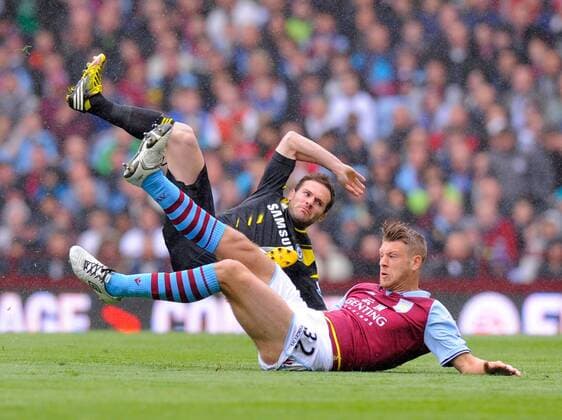 Nathan Baker of Aston Villa tackles Juan Mata of Chelsea, the tackle earned Baker a yellow card - Barclays Premier League - Aston Villa vs Chelsea - Villa Park Stadium - Birmingham - England - 11 05 13 - Picture Simon Bellis Sportimage EDITORIAL USE ONLY. No use with unauthorised audio, video, data, fixture lists, club league logos or live services. Online in-match use limited to 120 images, no video emulation. No use in betting, games or single club league player publications.