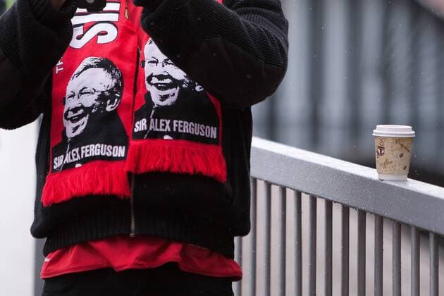 Football - Premier League 2012 2013 - Manchester United - A fan wears a Alex Ferguson, manager of Manchester United scarf at Old Trafford 