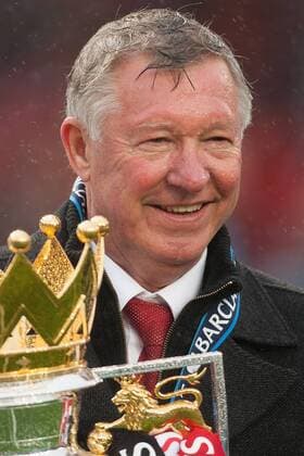 Football - Premier League 2012 2013 - Manchester United - Alex Ferguson, manager of Manchester United celebrates with the trophy at Old Trafford 