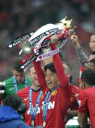 Shinji Kagawa of Manchester United lifts the Premier League trophy - Barclays Premier League - Manchester United ManU - Old Trafford Stadium - Manchester - England - 12 05 13 - EDITORIAL USE ONLY. No use with unauthorised audio, video, data, fixture lists, club league logos or live services. Online in-match use limited to 120 images, no video emulation. No use in betting, games or single club league player publications.