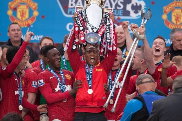 Football - Premier League 2012 2013 - Manchester United ae Ashley Young of Manchester United lifts the trophy at Old Trafford 