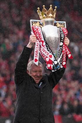 Football - Premier League 2012 2013 - Manchester United ae Alex Ferguson, manager of Manchester United celebrates with the trophy at Old Trafford