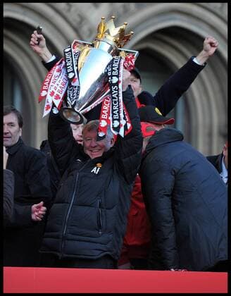 Sir Alex Ferguson lifts the Trophy as he addresses fans in Albert Square, Manchester, As Manchester United celebrate winning their 20th league title winning the Premier League, Monday May 13, 2013. AndrewxParsonsx xi-Images  AJP