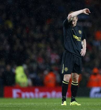 Wigan s Ben Watson looks on dejected at the final whistle - Barclays Premier League - Arsenal vs Wigan - Emirates Stadium - London - 14 05 2013 - Pic David Klein Sportimage EDITORIAL USE ONLY. No use with unauthorised audio, video, data, fixture lists, club league logos or live services. Online in-match use limited to 120 images, no video emulation. No use in betting, games or single club league player publications.