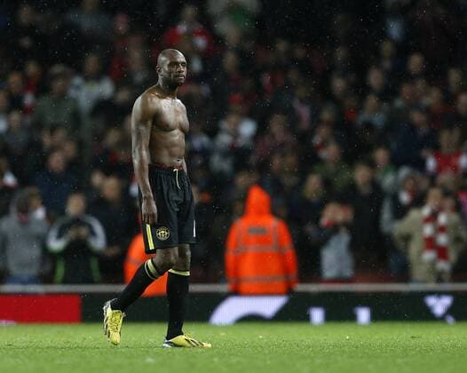 Arsenal s Emmerson Boyce looks on dejected at the final whistle - Barclays Premier League - Arsenal vs Wigan - Emirates Stadium - London - 14 05 2013 - Pic David Klein Sportimage EDITORIAL USE ONLY. No use with unauthorised audio, video, data, fixture lists, club league logos or live services. Online in-match use limited to 120 images, no video emulation. No use in betting, games or single club league player publications.