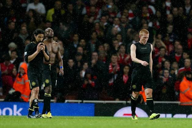Football - 2012 2013 Premier League - Arsenal vs Wigan Wigan s Ben Watson, Wigan s Emmerson Boyce and Wigan s Roger Espinoza look dejected after losing at the Emirates Stadium, London 